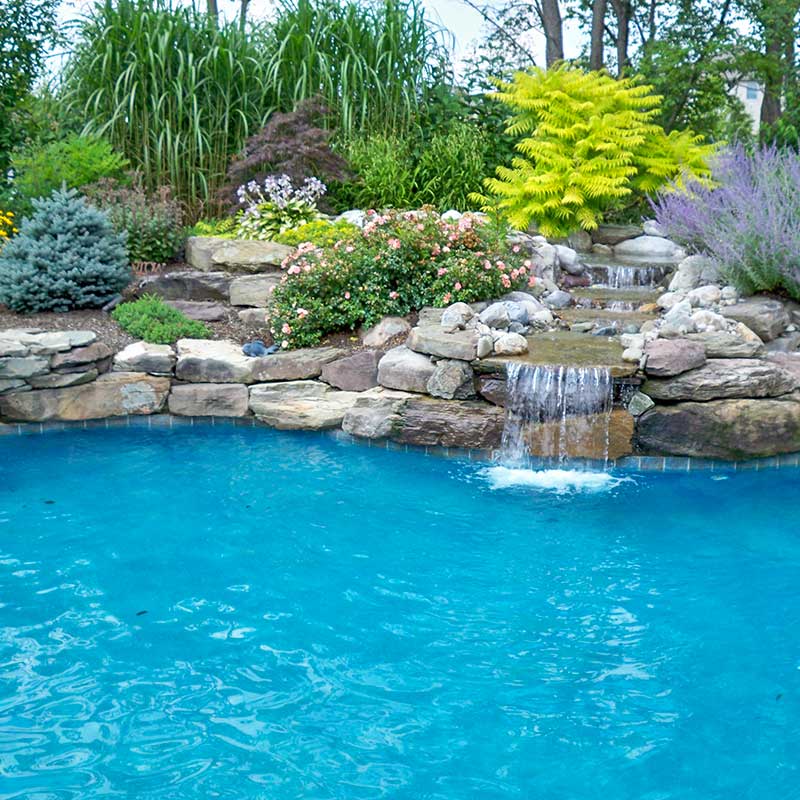 landscaped pool with waterfall