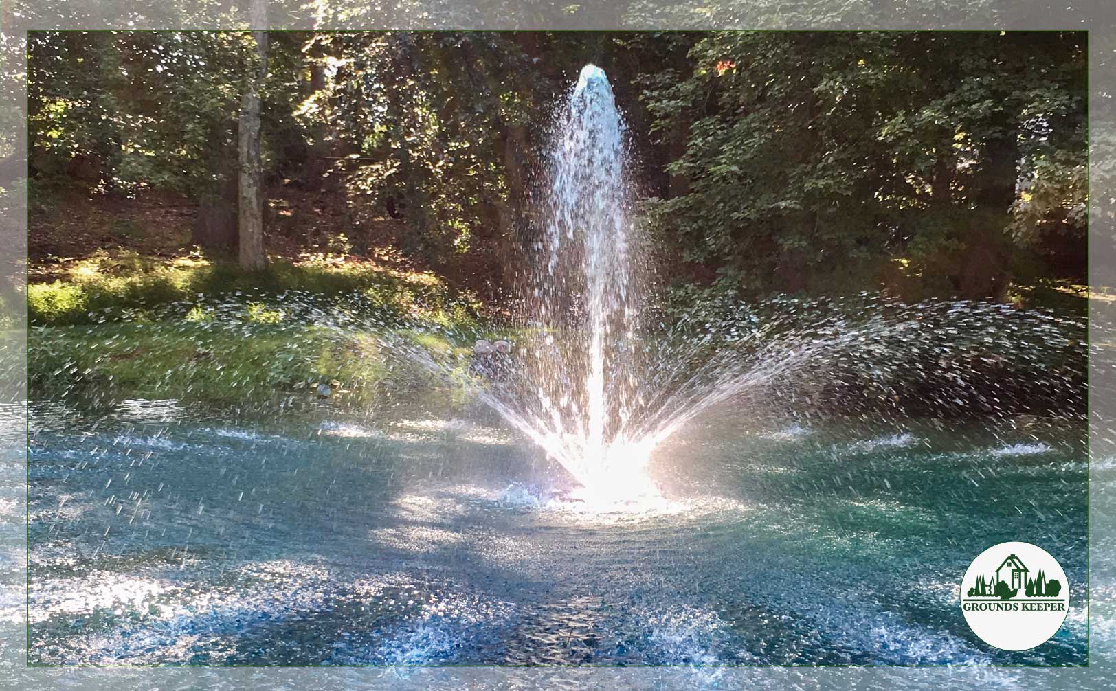 fountain in large pond 