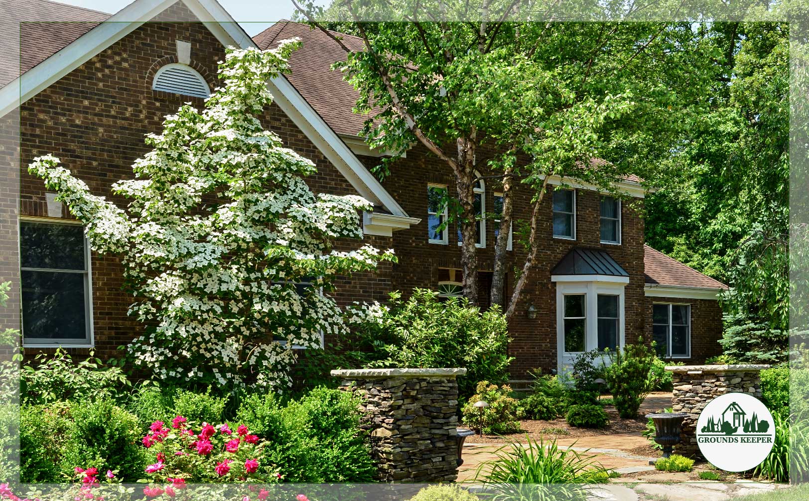 naturalistic front yard with pavingstone walkway in spring 