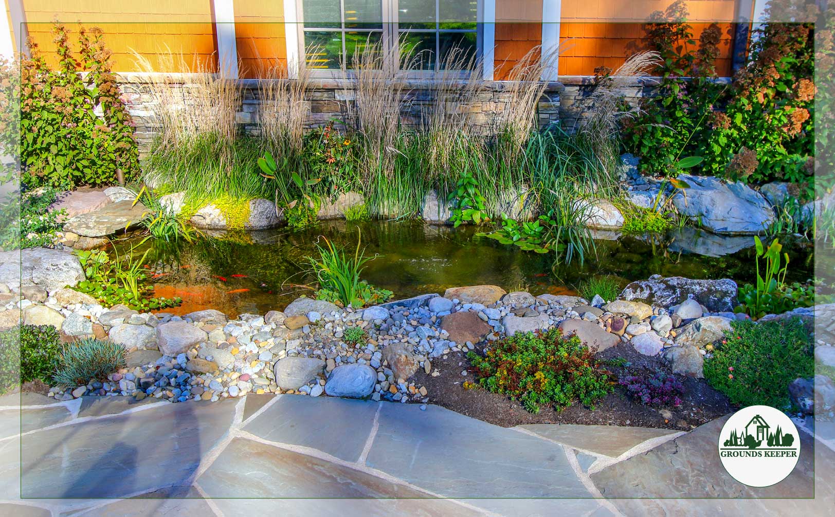 layered color with water stone grasses and goldfish 