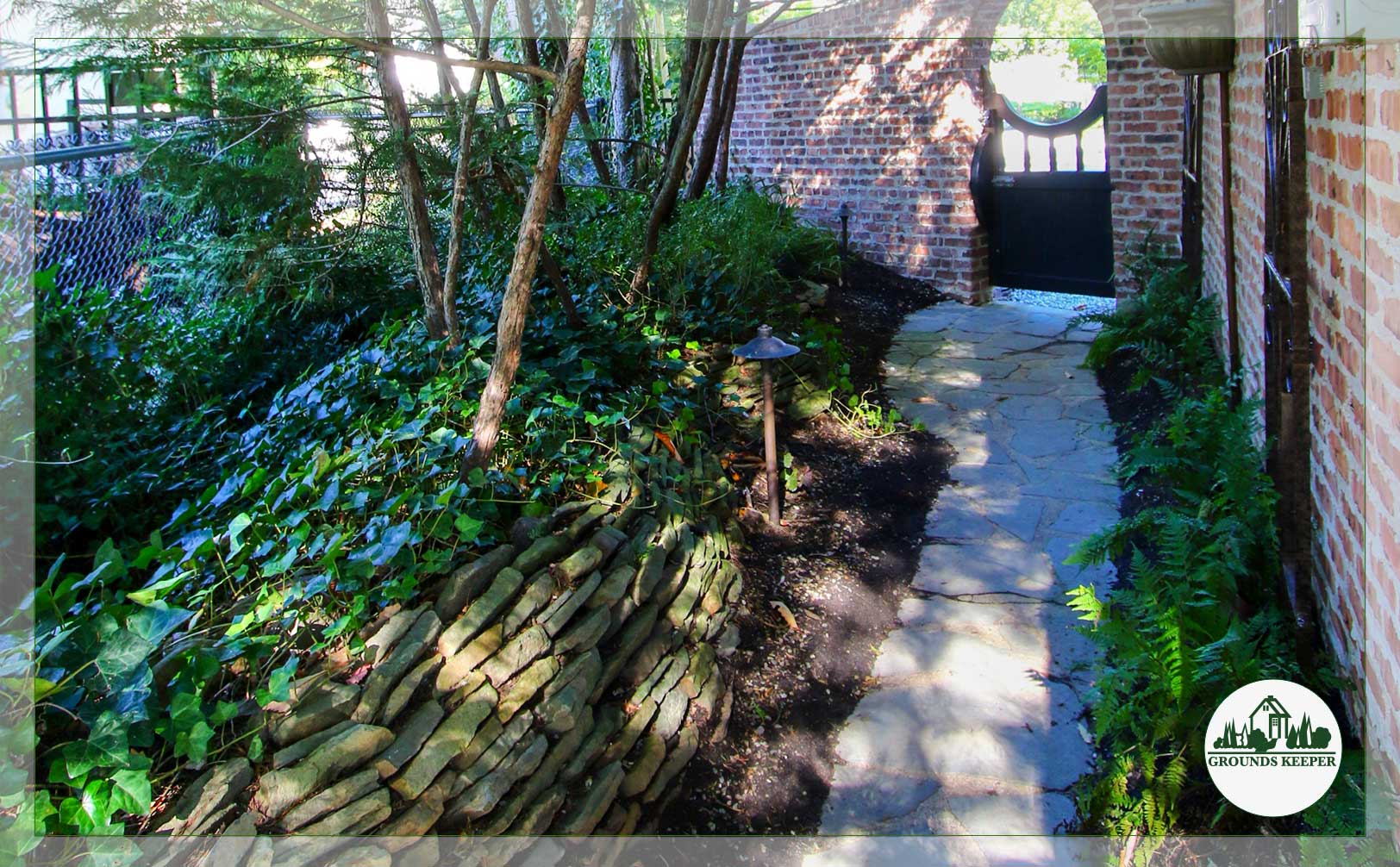 side yard with stone wall